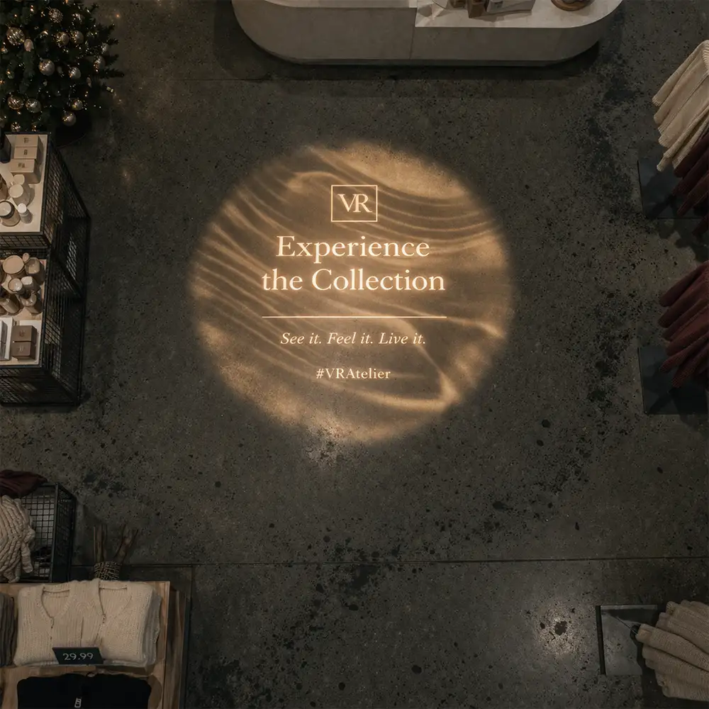 Storefront logo and entry projection outside a retail storefront
